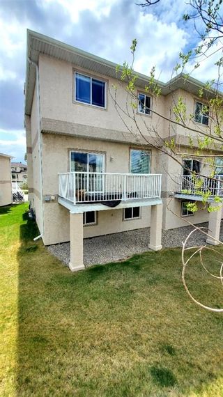 Photo 3: 82 Country Hills Gardens NW in Calgary: Country Hills Row/Townhouse for sale : MLS®# A1209355