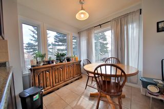 Photo 5: 10 388 Sandarac Drive NW in Calgary: Sandstone Valley Row/Townhouse for sale : MLS®# A1181075