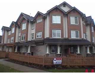Photo 1: 8717 159TH Street in Surrey: Fleetwood Tynehead Townhouse for sale in "Springfield Gardens" : MLS®# F2623924