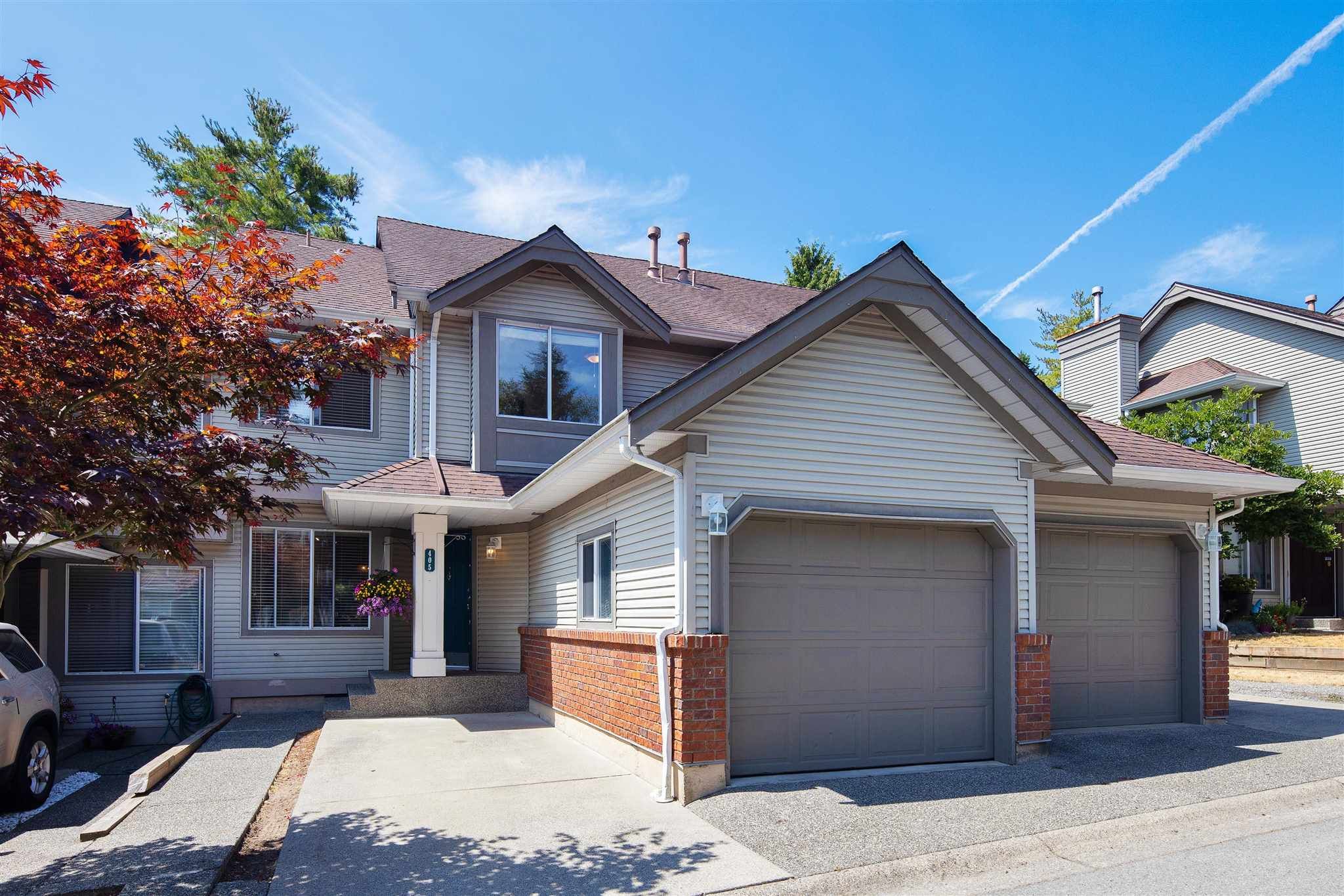 Main Photo: 405 13900 HYLAND Road in Surrey: East Newton Townhouse for sale in "HYLAND GROVE" : MLS®# R2605860