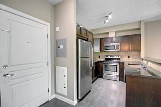 Photo 4: 209 76 Panatella Road NW in Calgary: Panorama Hills Apartment for sale : MLS®# A1244884