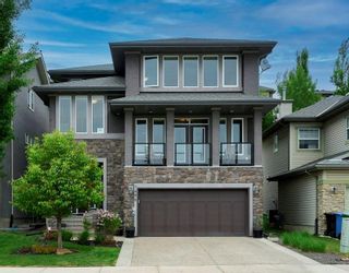 Photo 1: 7496 Springbank Way SW in Calgary: Springbank Hill Detached for sale : MLS®# A2053120