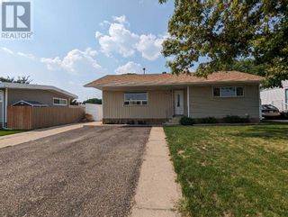 Photo 1: 1312 Division Avenue NW in Medicine Hat: House for sale : MLS®# A2076974