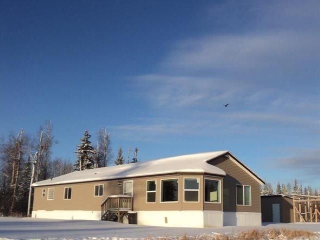Main Photo: 128 MCCONACHIE CREEK Road in Fort Nelson: Fort Nelson - Rural Manufactured Home for sale : MLS®# R2722562