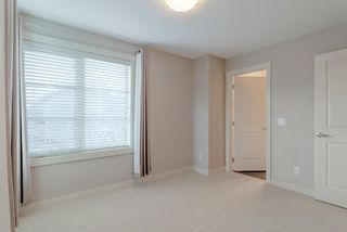 Photo 19: 18 Aspen Hills Common SW in Calgary: Aspen Woods Row/Townhouse for sale : MLS®# A1195955