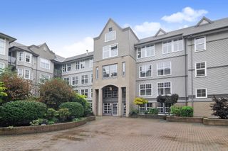 Photo 1: 308 20200 56 AVENUE in Langley: Langley City Condo for sale : MLS®# R2509709