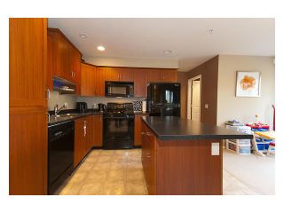 Photo 2: 101 3000 RIVERBEND Drive in Coquitlam: Coquitlam East House for sale in "RIVERBEND" : MLS®# V859605