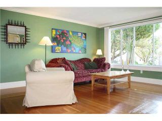 Photo 2: 4960 MOSS Street in Vancouver: Collingwood VE House for sale (Vancouver East)  : MLS®# V899142