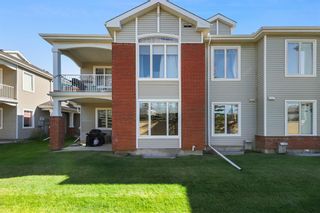 Photo 2: 406 8000 Wentworth Drive SW in Calgary: West Springs Row/Townhouse for sale : MLS®# A2002880