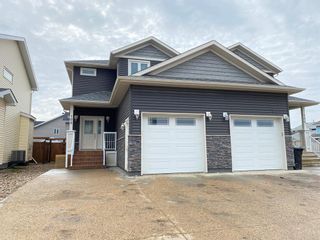Photo 1: 102 Athabasca Crescent: Fort McMurray Semi Detached (Half Duplex) for sale : MLS®# A2036846