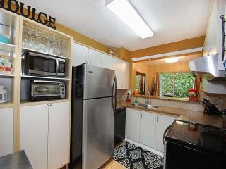 Photo 7: 38 2736 ATLIN Place in Coquitlam: Coquitlam East Townhouse for sale in "CEDAR GREEN ESTATES" : MLS®# V1137675