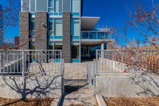 Photo 3: 102 88 Waterfront Mews SW in Calgary: Chinatown Apartment for sale : MLS®# A2116284