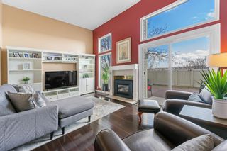 Photo 3: 716 Queenston Terrace SE in Calgary: Queensland Row/Townhouse for sale : MLS®# A2039290