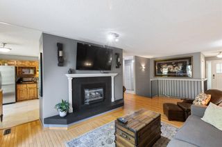 Photo 3: 106 Strathlorne Mews SW in Calgary: Strathcona Park Row/Townhouse for sale : MLS®# A1174641