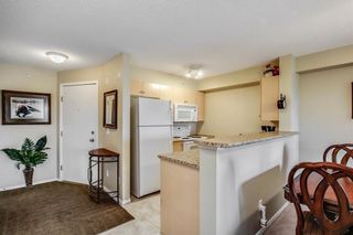 Photo 4: 1423 8 BRIDLECREST Drive SW in Calgary: Bridlewood Condo for sale : MLS®# C4138425