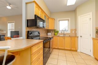 Photo 6: 101 248 SUNTERRA RIDGE Place: Cochrane Apartment for sale : MLS®# C4294936