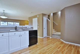 Photo 12: 59 Tuscany Springs Gardens NW in Calgary: Tuscany Row/Townhouse for sale : MLS®# A2003672