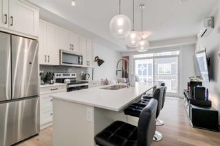 Photo 2: 311 500 Auburn Meadows Common SE in Calgary: Auburn Bay Apartment for sale : MLS®# A2127655