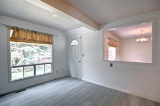 Photo 13: 130 Strathlorne Mews SW in Calgary: Strathcona Park Row/Townhouse for sale : MLS®# A1252004