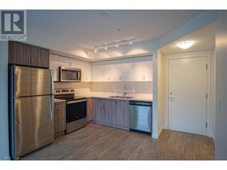 Photo 2: 625 Academy Way Unit# 110 in Kelowna: House for sale : MLS®# 10303620