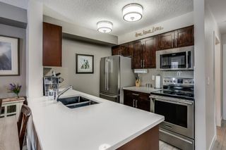 Photo 4: 7206 403 Mackenzie Way SW: Airdrie Apartment for sale : MLS®# A1067554