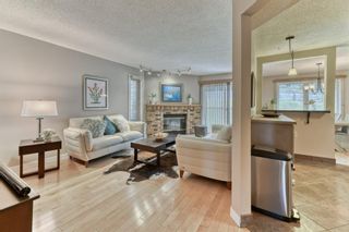 Photo 5: 85 Coachway Gardens SW in Calgary: Coach Hill Row/Townhouse for sale : MLS®# A1110212