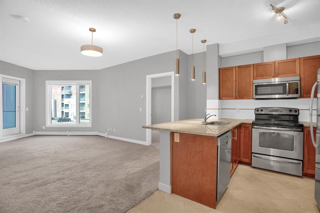 Main Photo: 2215 604 East Lake Boulevard NE: Airdrie Apartment for sale : MLS®# A2043886