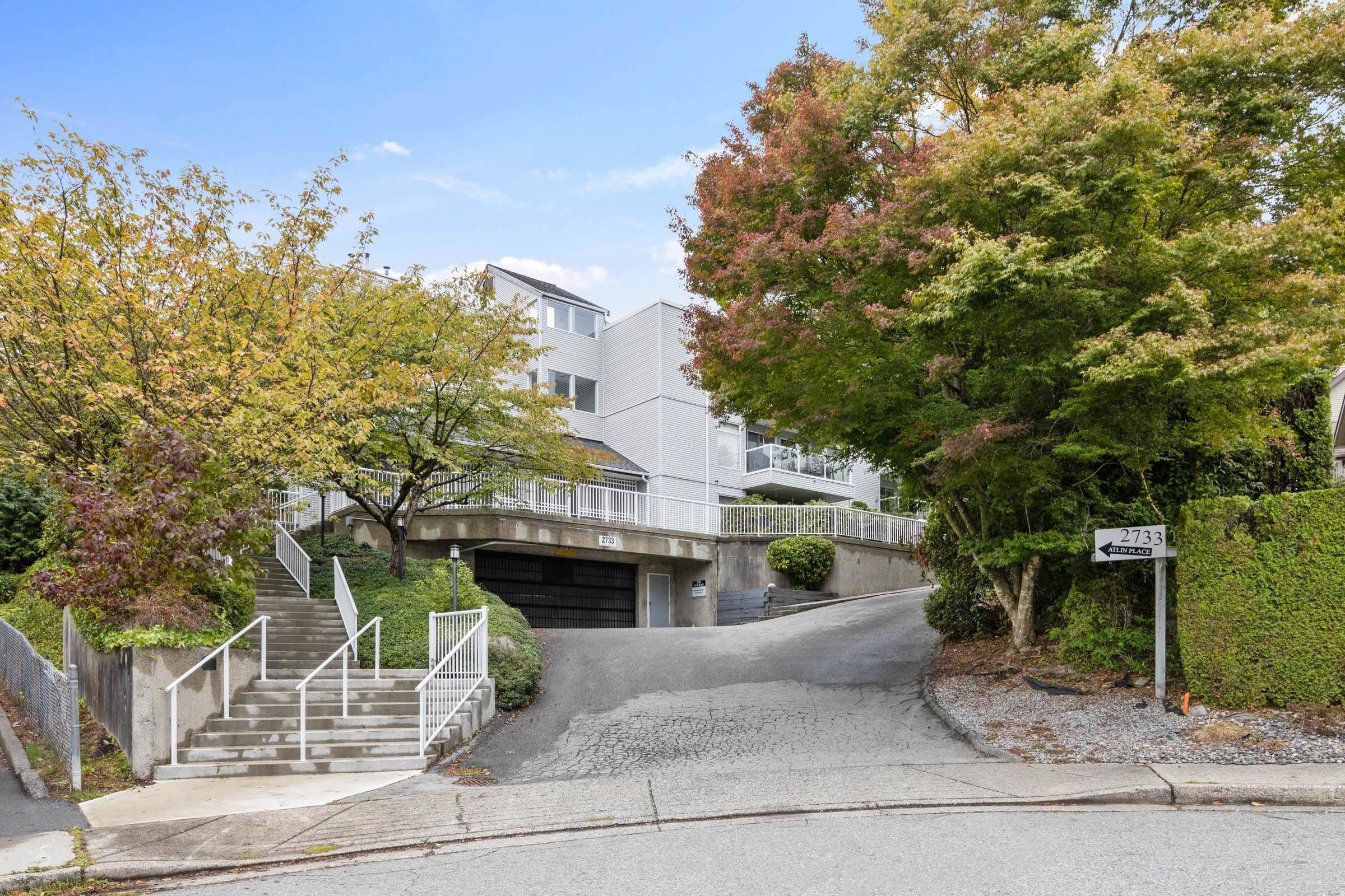 Main Photo: 304 2733 ATLIN Place in Coquitlam: Coquitlam East Condo for sale in "ATLIN COURT" : MLS®# R2820393