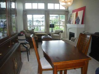Photo 3: 415 3110 DAYANEE SPRINGS Boulevard in Coquitlam: Westwood Plateau Condo for sale in "LEDGEVIEW" : MLS®# V963345
