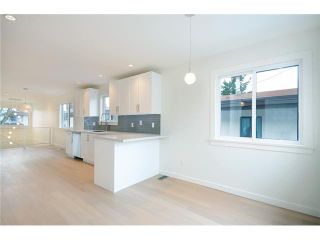 Photo 9: 985 E 38TH Avenue in Vancouver: Fraser VE House for sale in "FRASER" (Vancouver East)  : MLS®# V1048813