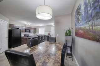Photo 10: 555 Panatella Boulevard NW in Calgary: Panorama Hills Row/Townhouse for sale : MLS®# A2034434