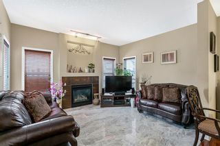 Photo 7: 305 Bridleridge View SW in Calgary: Bridlewood Detached for sale : MLS®# A2043145