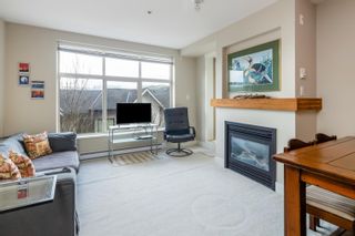 Photo 2: 319 1211 VILLAGE GREEN Way in Squamish: Downtown SQ Condo for sale in "Rockcliff" : MLS®# R2759438