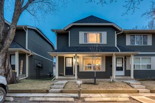 Photo 1: 530 Queenston Gardens SE in Calgary: Queensland Row/Townhouse for sale : MLS®# A2130414