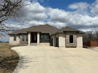 Photo 1: 23 Hidden Oaks Cove in Winnipeg: The Oaks Residential for sale (5W)  : MLS®# 202307887