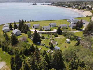 Photo 1: 36083 Cabot Trail Highway in Ingonish: 209-Victoria County / Baddeck Multi-Family for sale (Cape Breton)  : MLS®# 202312326