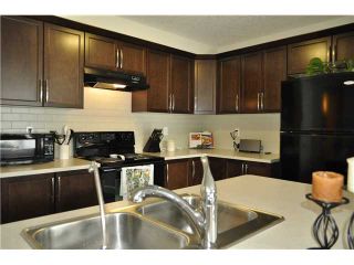 Photo 5: 118 WINDSTONE Crescent SW: Airdrie Townhouse for sale : MLS®# C3590682
