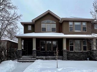 Photo 1: 105 15 Street NW in Calgary: Hillhurst Semi Detached for sale : MLS®# A1169167