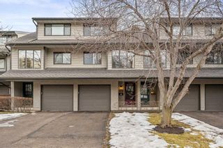 Photo 1: 132 Point Drive NW in Calgary: Point McKay Row/Townhouse for sale : MLS®# A2105102