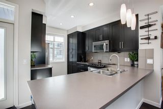 Photo 6: 25 Nolan Hill Boulevard NW in Calgary: Nolan Hill Row/Townhouse for sale : MLS®# A1073850