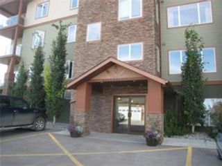 Photo 1: 209 4403 67A Avenue: Olds Apartment for sale : MLS®# A1162198