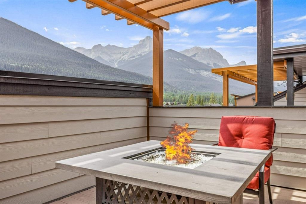 Main Photo: 704 102 Stewart Creek Rise: Canmore Row/Townhouse for sale : MLS®# A1250551