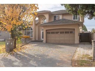 Photo 1: 7617 127 Street in Surrey: West Newton House for sale : MLS®# R2514489