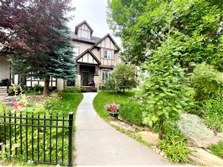 Photo 1: 2 Somme Mews SW in Calgary: Garrison Woods Row/Townhouse for sale : MLS®# A1195507