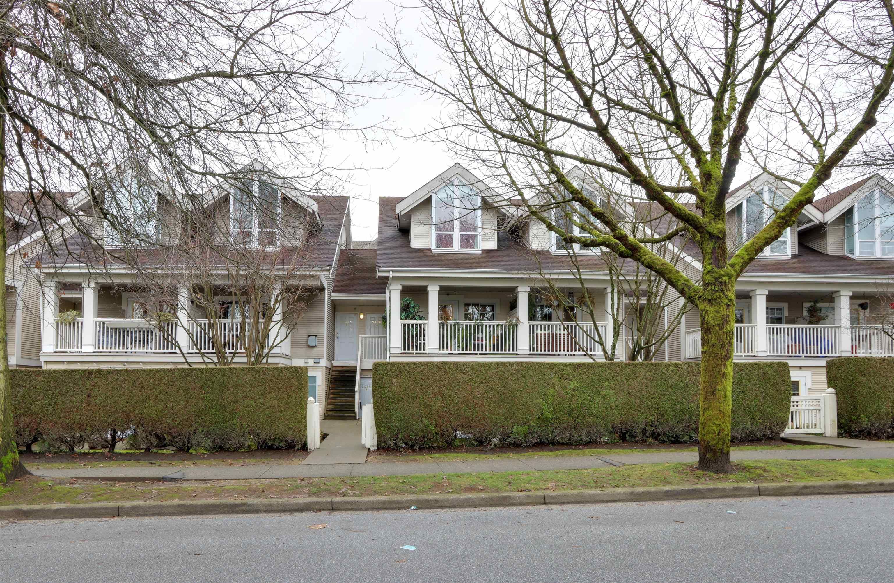 Main Photo: 2428 E 8TH Avenue in Vancouver: Renfrew VE Townhouse for sale in "8TH AVENUE GARDENS" (Vancouver East)  : MLS®# R2650592