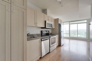 Photo 2: 911 30 Brentwood Common NW in Calgary: Brentwood Apartment for sale : MLS®# A1230844