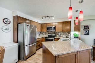 Photo 4: 7403 304 Mackenzie Way SW: Airdrie Apartment for sale : MLS®# A1251468