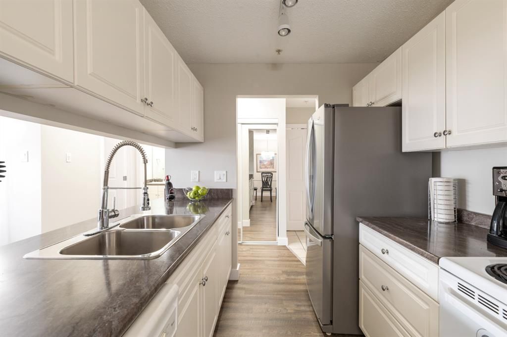 Loads of countertop and cabinet space with built-in appliances in the kitchen and updated countertops.