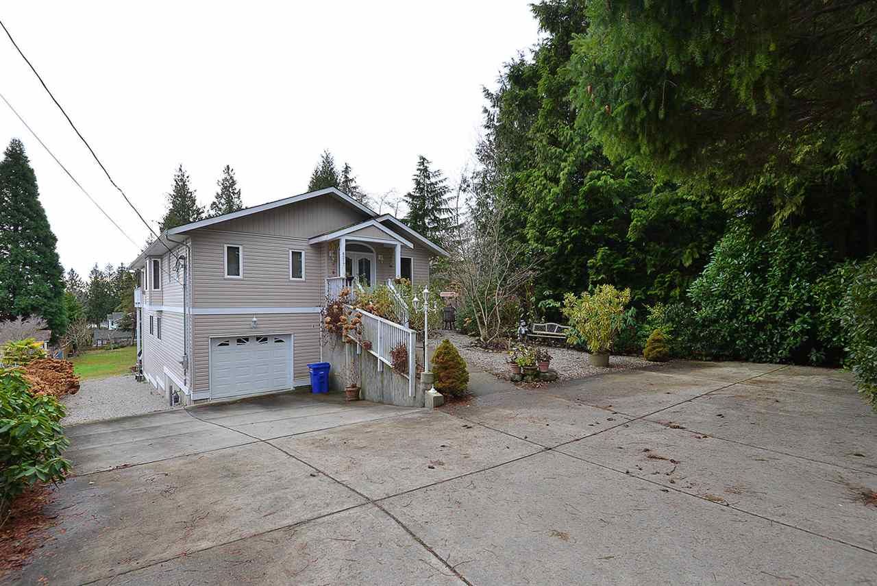 Custom home with lots of parking; attached garage, access to back yard.  Central location in sunny West Sechelt close to schools, churches, bus route and fabulous views.