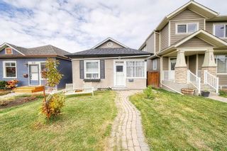 Photo 2: 210 20 Avenue NW in Calgary: Tuxedo Park Detached for sale : MLS®# A2084355